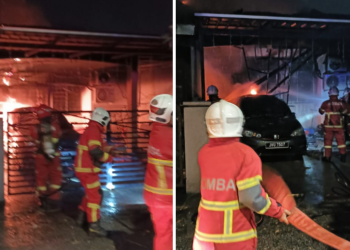 ANGGOTA bomba memadamkan kebakaran rumah di Taman Permai Impian, Seremban. - FOTO/IHSAN BOMBA