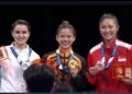Tan Cheong Min (tengah) meraih pingat emas dalam acara Nanquan-Nandao bersama wakil Uzbekistan, Latisheva Darya (kiri) merangkul perak manakala  atlet Singapura, Kassandra Ong ditempat ketiga pada temasya Sukan Dunia di Chengdu, China, hari ini. - IHSAN FB WFM