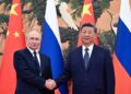 PRESIDEN Russia, Vladimir Putin berjabat tangan dengan rakan sejawatnya, Presiden China, Xi Jinping semasa pertemuan di Beijing, China. – AFP
