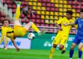Pemain skuad bawah 23 negara, Fergus Tierney cuba melakukan sepakan gunting dalam aksi Kelayakan Piala Asia Bawah 23 menentang Mongolia di Thailand, kelmarin. Malaysia menang 7-0. - IHSAN FAM