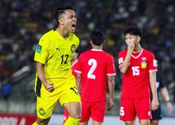 ARIF Aiman meraikan kejayaannya meledak gol pertama Harimau Malaya ketika berdepan Laos, kelmarin.-IHSAN MALAYSIA NT.