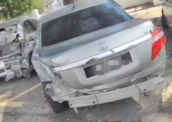 KEADAAN kereta yang dirempuh van di kawasan tempat letak kereta berhampiran Stesen KTM Ipoh Ahad lalu.