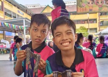 Allahyarham Muhammad Zafri (kanan)