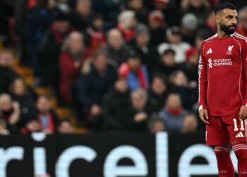 Penyerang Liverpool, Mohamed Salah sugul selepas pasukannya tewas 1-4 kepada PSV Eindhoven dalam saingan Liga Juara-Juara di Anfield, semalam. - AFP