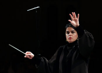 Paniz Faryoussefi, the first woman to conduct the Tehran Symphony Orchestra, leads the ensemble at the Vahdat Hall in Tehran on November 13, 2025. (Photo by AFP)