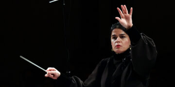 Paniz Faryoussefi, the first woman to conduct the Tehran Symphony Orchestra, leads the ensemble at the Vahdat Hall in Tehran on November 13, 2025. (Photo by AFP)