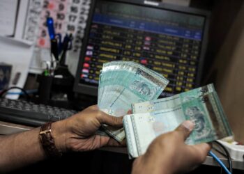 ringgit muncul antara mata wang berprestasi terbaik dalam kalangan negara ASEAN. - AFP