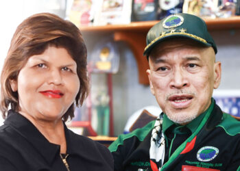 T. INDRANI dan Nadzim Johan.