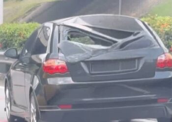 KEADAAN bumbung kereta jenis Proton Satria akibat dihempap tayar lori berhampiran pusat beli-belah IOI Putrajaya, semalam.