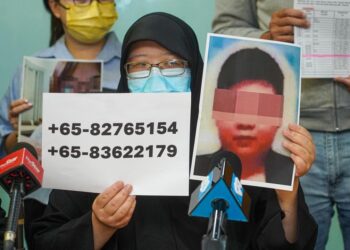 MANGSA yang tidak ingin dikenali ketika sidang media berkaitan kes penipuan peminjaman wang haram di Wisma MCA, Kuala Lumpur, hari ini. - UTUSAN/ISKANDAR ISHAK