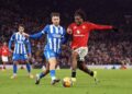 PEMAIN Manchester United, Patrick Dorgu mengasak pemain Brighton, Jack Hinshelwood pada aksi pusingan ketiga Piala FA di Old Trafford-AFP