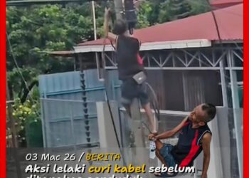 TANGKAP layar video aksi seorang lelaki yang memanjat tiang elektrik dan cuba memotong kabel dalam kejadian di Jelapang di Ipoh semalam.