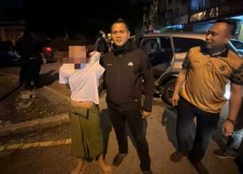 POLIS menahan lelaki warga Myanmar dipercayai terlibat dalam kes pembunuhan seorang wanita senegaranya yang ditemukan mati dikelar di sebuah asrama pekerja di Jalan Nilai Universiti, Nilai, kelmarin. - GAMBAR / IHSAN POLIS