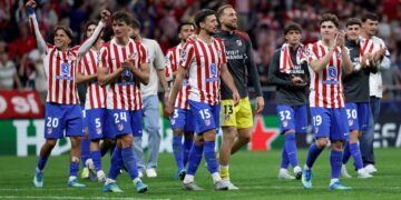 PEMAIN Atletico Madrid meraikan kejayaan mereka mara ke separuh akhir Liga Juara-Juara, semalam. - AFP