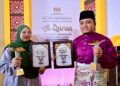 CIK Hasnul Taqiyiddin Cik Sazali (kanan) dan Nur Syakura Mohamad Musa muncul sebagai Qari dan Qariah Tilawah al-Quran Peringkat Kebangsaan di Stadium Tertutup Kompleks Sukan Negeri, Gong Badak, Kuala Nerus, Terengganu. -UTUSAN/PUQTRA HAIRRY