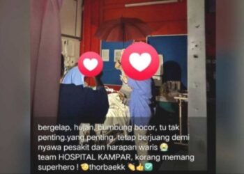 GAMBAR yang tular petugas kesihatan Hospital Kampar menggunakan payung selepas air hujan memasuki ruangan wad pesakit.