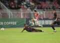 MUHAMMAD Faiz Nasir cuba melepasi kawalan pemain pertahan Kelantan WTS pada aksi Liga A1 Semi-Pro di Stadium Sultan Muhammad IV, Kota Bharu, Kelantan. - IHSAN KRW FC