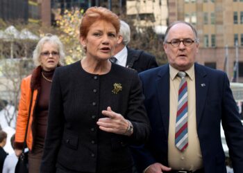 HANSON (depan) mengetuai Parti One Nation. - AFP