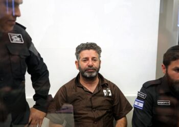 SAIF Abu Keshek (tengah) menerima ancaman bunuh. - AFP