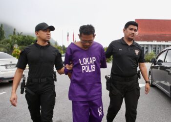 MOHD. Shahifuldin Mohd. Shahiran dituduh memiliki senjata api dan peluru di Mahkamah Sesyen dan Majistret Baling, hari ini. - UTUSAN/ SHAHIR NOORDIN