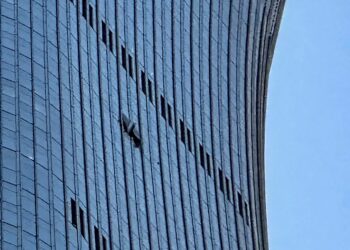 LUBANG terbentuk selepas pesawat merempuh Menara CITIC. - AFP