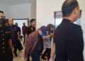 FAKHRUDIN Abd. Karim diiring pegawai SPRM ketika dihadapkan ke Mahkamah Sesyen, Shah Alam, Selangor atas 158 pertuduhan rasuah, semalam.