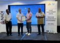 FAHMI Fadzil (dua kiri) menyampaikan Watikah Pelantikan Pengerusi Panel Penasihat Pusat Sebaran Maklumat Nasional (Nadi) Negeri Kelantan di Kota Bharu, Kelantan.