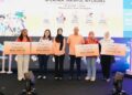 DATUK Khairul Kamarudin menyampaikan sumbangan kepada wakil empat persatuan ibu tunggal sempena pelancaran M-Zahra Takaful MyLadies.
