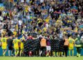 PEMAIN Denmark dan Ukraine mengelilingi Christian Eriksen ketika bintang Denmark itu dibawa keluar untuk menerima rawatan selepas rebah ketika aksi persahabatan antarabangsa di Stadium Odense, hari ini. - AFP