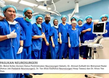 Pasukan doktor yang mengendalikan pembedahan pemisahan pasangan kembar siam jenis Pygopagus membabitkan dua bayi perempuan dari kawasan pedalaman di Sabah. - IHSAN  JABATAN KESIHATAN NEGERI SABAH