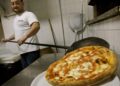 Piza amat terkenal di Naples dan pengambilan secara berlebihan akan menyebabkan obesiti. - AFP