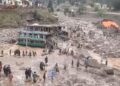 RAKAMAN video menunjukkan bangunan yang rosak ketika orang ramai berkumpul di lokasi bencana banjir di wilayah Nuristan, Afghanistan.- AFP
