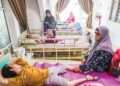 SARIPAH Arabiah Che Embong membawa cucunya, Ahmad Benyamin Abdullah yang menghidap hydrocephalus, spina bifida dan cerebral palsy menjalani terapi di Rumah Anak Permata Syurga di Kampung Gelugor Kedai, Kuala Terengganu, Terengganu.