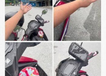 Beberapa motosikal yang diletakkan di tepi jalan berdekatan pintu masuk lif terjejas akibat percikan air simen basah.