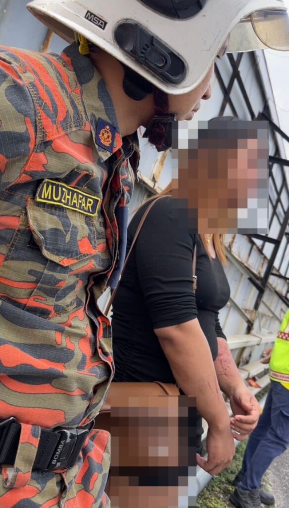 Firefighters Persuade Man in Women's Clothing to Step Back from Bridge Ledge