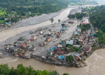 RUMAH-rumah ditenggelami lumpur selepas banjir kilat melanda Devighat, Perbandaran Bidur di daerah Nuwakot, Nepal. - AFP