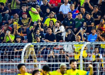 PARA Penyokong Harimau Malaya yang hadir ke Stadium Bolasepak Kuala Lumpur, Cheras ketika aksi Malaysia menentang Laos, minggu lalu.-IHSAN FAM