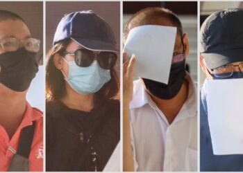 EMPAT tertuduh (dari kiri) Wong Joon Hong, Phua Ai Ling, Neoh Wooi Lee, dan Goh Chee Wai hadir ke Mahkamah Sesyen George Town, Pulau Pinang hari ini atas pertuduhan mengemukakan tuntutan palsu di bawah Program Insentif Daya Kerjaya 2.0 kepada Perkeso, dua tahun lalu.-UTUSAN/DANIAL SAAD