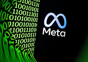 LOGO Meta pada skrin sebuah telefon bimbit. - AFP