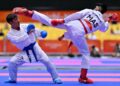 Atlet karate Malaysia, Thevendran Kaliana Sundram (kanan) beraksi menentang wakil Nepal, Rakesh Manandhar dalam pertarungan pingat gangsa kumite lelaki bawah 55kg pada Sukan Asia Aichi-Nagoya 2026 di Gimnasium Toyohashi, Aichi, hari ini.-AFP