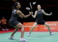 Pearly Tan-M. Thinaah beraksi menentang Liu Sheng Shu-Tan Ning dalam separuh akhir beregu wanita Sukan Asia Aichi-Nagoya 2026 di Ichinomiya City Municipal Gymnasium, semalam. - BERNAMA