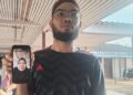 WAB Muhammad Naim Wan Hussin menunjukkan foto Rubayyi Razak ketika ditemui di Unit Forensik Hospital Besut, Terengganu. - UTUSAN /WAN ZURATIKAH IFFAH WAN ZULKIFLI