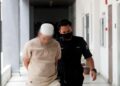 TERTUDUH semasa dibawa ke mahkamah untuk prosiding pertuduhan di Mahkamah Seysen, Kota Bharu, Kelantan. - UTUSAN/KAMARUL BISMI KAMARUZAMAN
