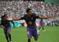 Lamine Yamal meraikan jaringan gol dalam aksi La Liga menentang Real Betis di La Cartuja, Seville, semalam. - AFP