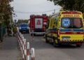 SEBUAH ambulans ditempatkan di Sekolah Rendah John Paul II di Leszczydol-Nowiny. - AFP