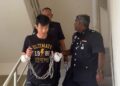 TAN Teek Lai ketika dibawa bagi berdepan pertuduhan cuba membunuh seorang anggota polis Unit Kereta Peronda (MPV) dalam satu insiden kejar-mengejar di Damansara Damai ketika dibawa ke Mahkamah Sesyen, di sini hari ini.