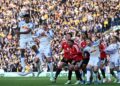 PEMAIN pertahanan Leeds United, James Justin (kiri), menanduk keluar bola ketika beraksi menentang Manchester United dalam aksi Liga Perdana Inggeris di Elland Road, Leeds, England, hari ini. - AFP