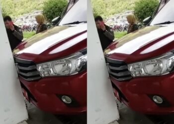 GAMBAR menunjukkan kereta rasmi kerajaan yang dirosakkan oleh Ketua Unit Polis Perkhidmatan Awam Padang Panjang. -AGENSI