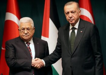 RECEP Tayyip Erdogan berjabat tangan dengan Mahmoud Abbas dalam sidang akhbar bersama selepas mengadakan pertemuan di Bangunan Presiden di Ankara. - AFP 