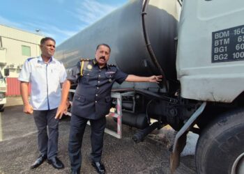 S. JEGAN menunjukkan lori yang dirampas daripada satu sindiket penyelewengan diesel subsidi dalam sidang akhbar di Stor Penyimpanan Eksibit KPDN Bukit Minyak du Bukit Mertajam, Pulau Pinang hari ini. - PIX: IQBAL HAMDAN